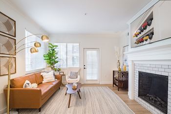 a living room with a couch and fireplace at Terracina, Broomfield, CO 80020